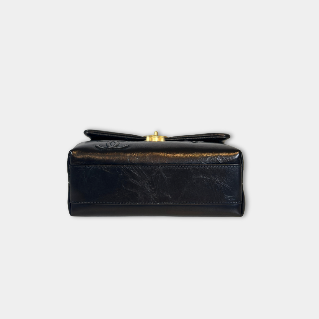Chanel Black Aged Calfskin Camellia Embossed Flap Bag Kelly's Authentic Boutique