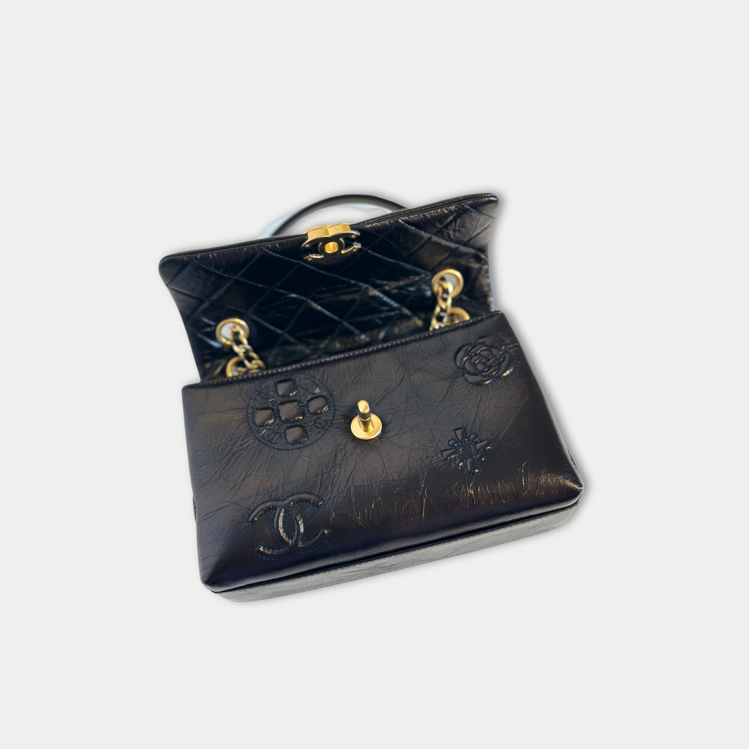 Chanel Black Aged Calfskin Camellia Embossed Flap Bag Kelly's Authentic Boutique