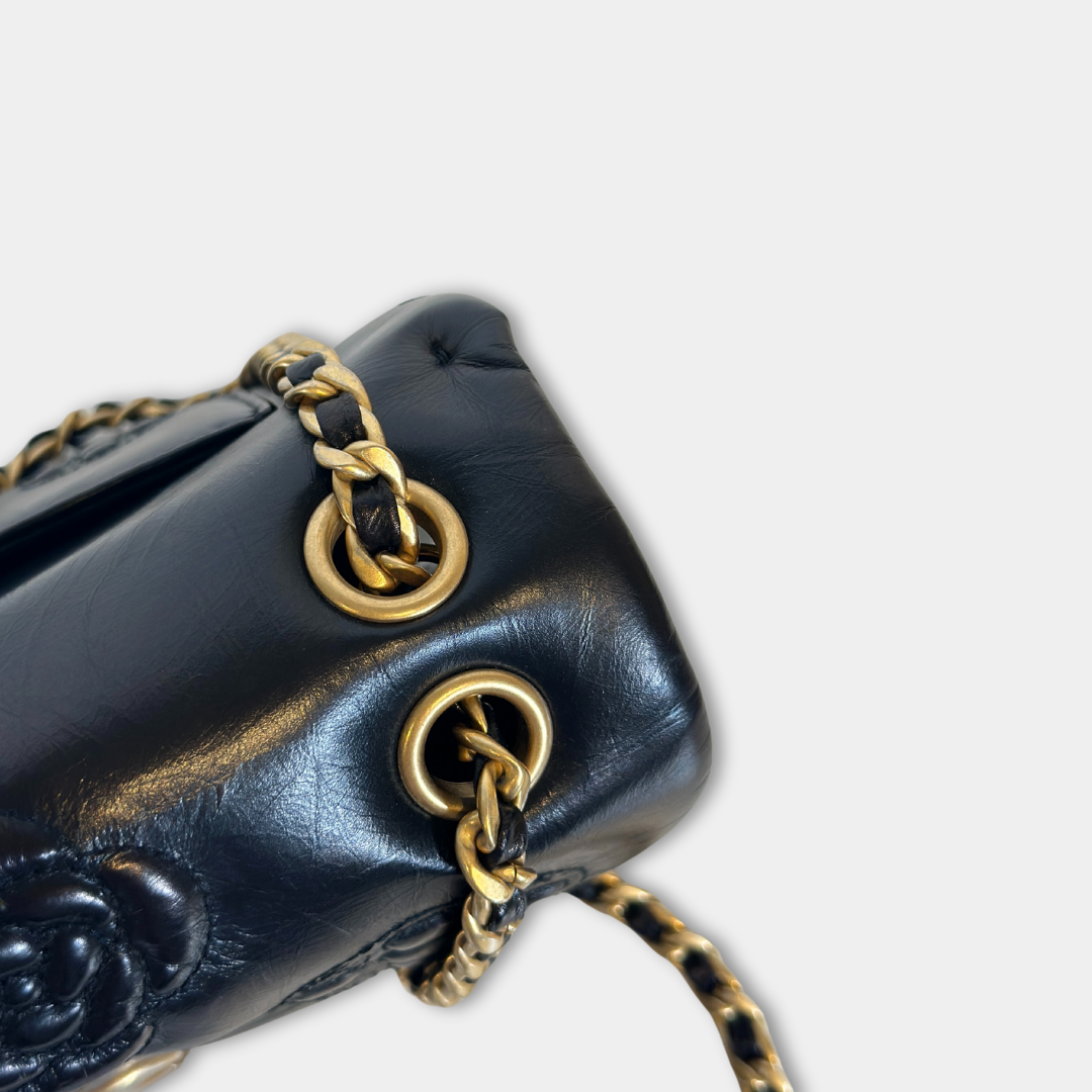 Chanel Black Aged Calfskin Camellia Embossed Flap Bag Kelly's Authentic Boutique