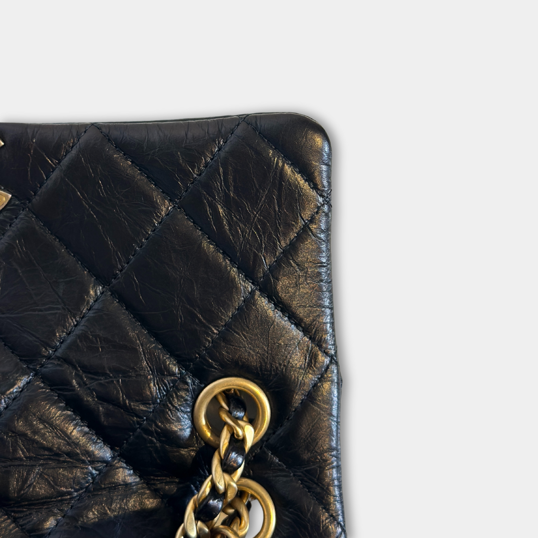 Chanel Black Aged Calfskin Camellia Embossed Flap Bag Kelly's Authentic Boutique