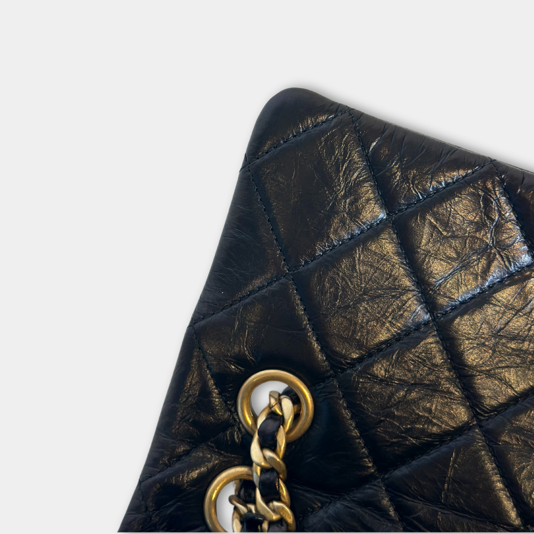 Chanel Black Aged Calfskin Camellia Embossed Flap Bag Kelly's Authentic Boutique